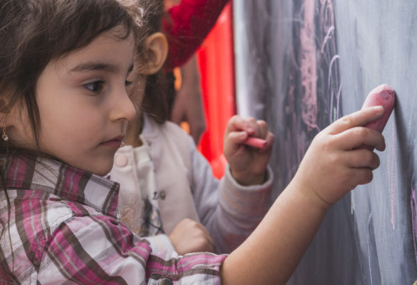 little-girl-drawing-blackboard-scaled.jpg